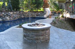 Add a Poolscapes fire pit or fireplace to your inground pool